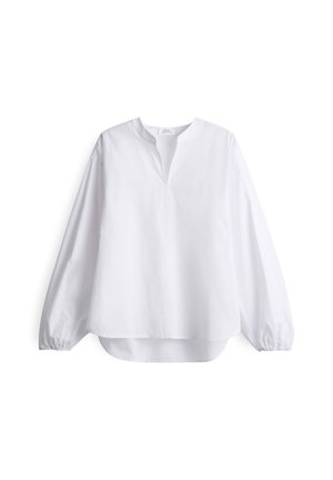 White long-sleeve shirt with a v-neckline, loose fit, gathered sleeves, and a curved hem, made from lightweight fabric.