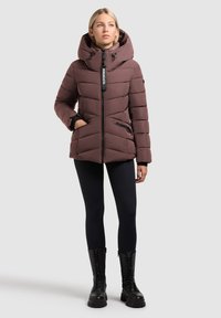 Brown puffer jacket with a high collar and hood, featuring horizontal quilted design, front zip closure, and side zippered pockets.