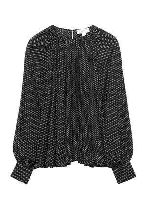 Svart blus med vita prickar, elastiska ärmslut, rynkad rundad halsringning och flödande tyg med lös passform.