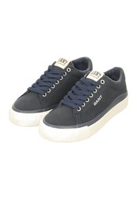Navy canvas sneakers with a textured white rubber sole, round toe, and lace-up design. "GANT" logo on the tongue and side.