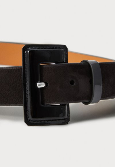 Black leather belt with a glossy black rectangular buckle, featuring a textured strap and an inner tan lining.