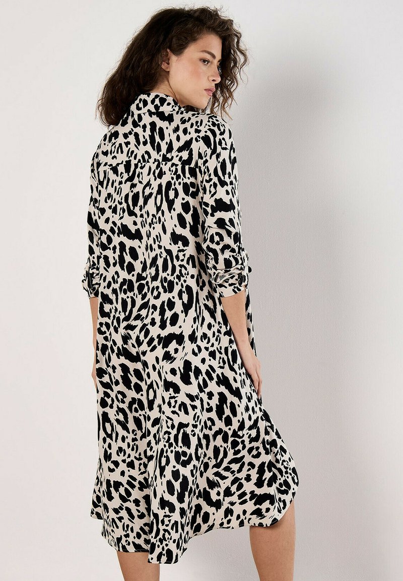 white christmas dresses Cream Cheetah Print Knotted Puff Sleeve Maternity Dress