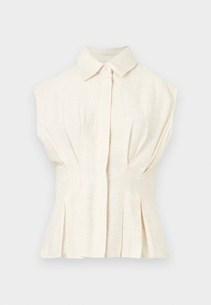 Αμάνικη μπλούζα σε κρεμ χρώμα με γιακά, μπροστινό κουμπωτό πλαϊνό και πιέτες στη μέση και στο τελείωμα.