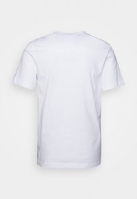 Plain white short-sleeve T-shirt shown from the back with a round neckline on a light background.
