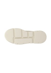 Soletta di sneaker color crema con texture ondulata e design segmentato. Presenta cuscinetti di trazione circolari per aderenza e flessibilità.