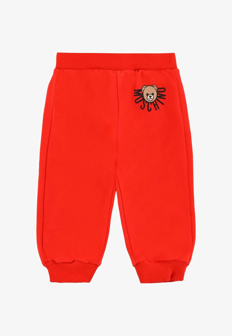 Czerwone dresy wykonane z bawełny, z elastycznym pasem i mankietami, z graficznym wzorem niedźwiedzia oraz napisem z przodu po lewej stronie.