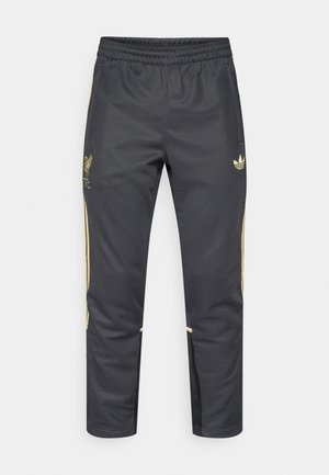 Pantaloni sportivi neri con vita elastica, caratterizzati da dettagli dorati e logo del Liverpool FC. Realizzati in tessuto liscio e leggero.
