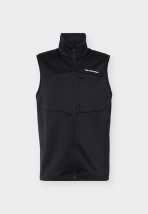 Veste noire sans manches avec col haut, fermeture éclair à l'avant et petit logo blanc "Peak Performance" sur la poitrine gauche.