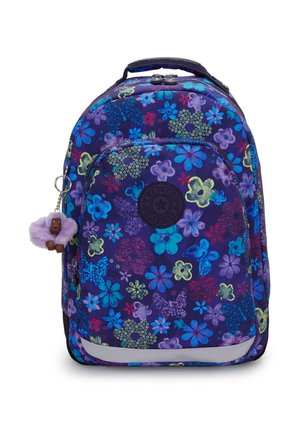 Sac à dos violet avec motif floral multicolore, poche avant, logo circulaire noir et un petit porte-clés singe violet attaché à la fermeture éclair.