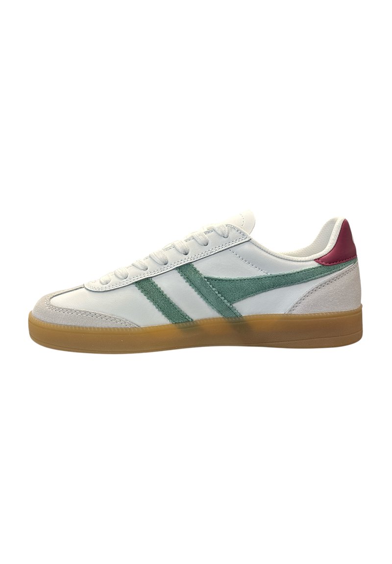 White sneaker with green suede stripes, pink heel accent, rubber gum sole, and textured body. Laced design and rounded toe.
