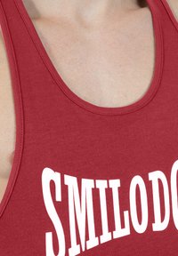 Smilodox - Top