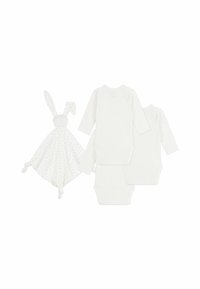 Trois bodysuits blancs à manches longues et une douce couverture de sécurité blanche avec des oreilles de lapin et un motif à pois, nouée aux coins.