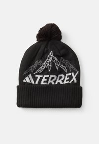 Zwarte gebreide muts met een geribde rand, voorzien van witte berggraphics en de tekst "TERREX", afgewerkt met een zwart pompon.