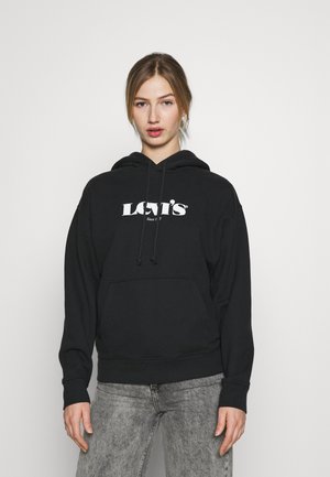 Felpa nera con cappuccio e tasca frontale. Presenta un logo bianco "Levi's" sul petto. Realizzata in un tessuto morbido per garantire comfort.
