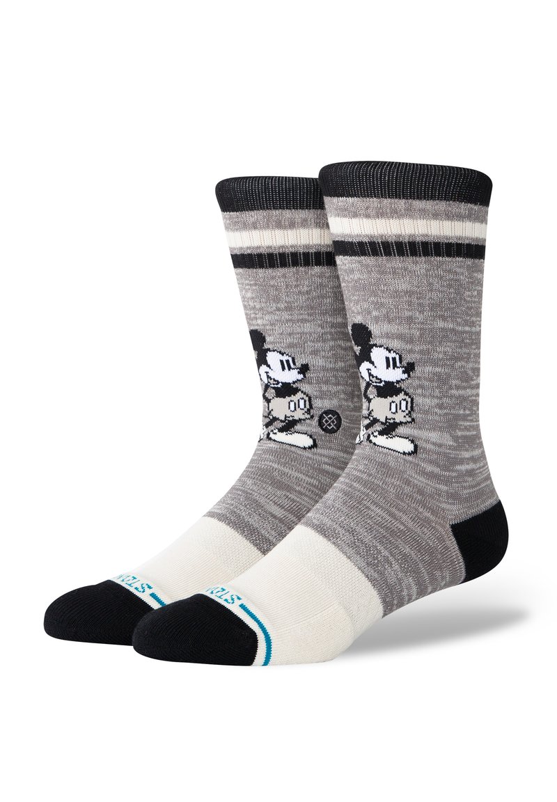 Grau gestreifte Socken in Schwarz und Weiß mit einem Cartoon-Charakter-Design. Hergestellt aus weichem Material mit verstärkten Zehen- und Fersenbereichen.