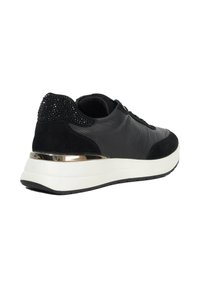 Black leather and suede sneaker with black rhinestones on heel, gold metallic trim, and thick white sole, shown in rear side view.