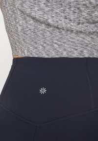 Athleta ELATION FLARE PANT - Leggings - navy