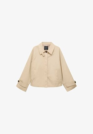 Beige verkürzte Jacke mit rundem Kragen, zwei Fronttaschen und geknöpften Manschetten. Hergestellt aus einem glatten, leichten Stoff.