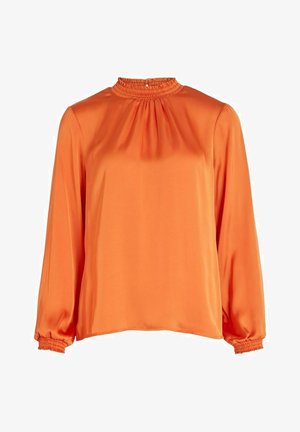 Long-sleeved orange blouse with a gathered neckline and elasticized cuffs. Smooth, shiny fabric with a relaxed fit and minimal design details.