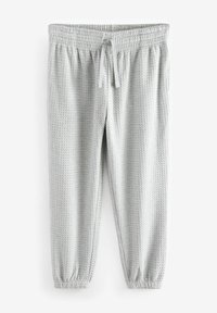 Hellegraue Pants mit Waffelstruktur, elastischem Bund und Zugband. Enganliegende Bündchen an den Knöcheln und eine lockere, schmal zulaufende Form.
