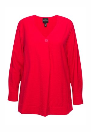 Haut rouge à manches longues en V avec une fermeture à un bouton, présentant un tissu texturé et une coupe ample, idéal pour un look décontracté.
