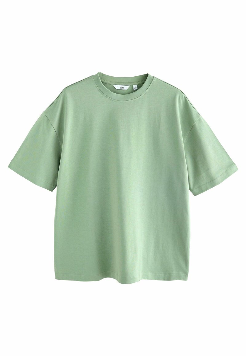 T-shirt uni à manches courtes vert clair avec col rond et coupe décontractée sur fond blanc.