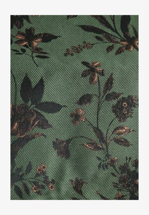 Zelená látka s květinovým vzorem v černé a hnědé barvě, s texturovaným, žebrovaným povrchem, který zvyšuje hloubku a vizuální zajímavost.