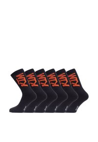 Chaussettes en coton noir dans un paquet de six, avec un motif géométrique orange et un logo sur la cheville. Longueur standard de type crew avec une texture lisse.