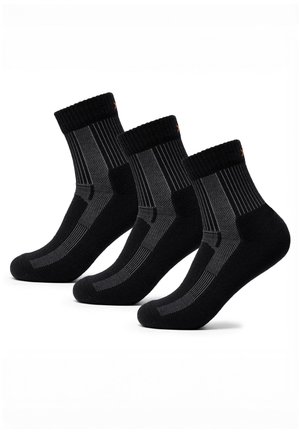 Drei Paare schwarz-graue knielange Socken mit geripptem Bündchen und gemusterten Belüftungseinsätzen vor weißem Hintergrund.