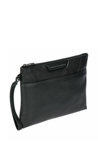 Pochette-bracelet en cuir noir avec fermeture éclair et logo "Porsche Design" sur le panneau avant.