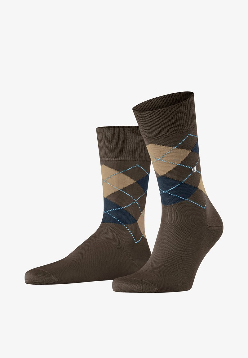 Chaussettes en coton marron avec un motif en losanges beige et bleu marine, rehaussées de coutures bleu clair. Partie supérieure côtière pour un maintien sécurisé.