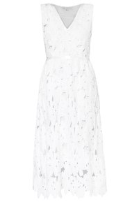 Robe midi blanche sans manches avec col en V et motif en dentelle ajourée florale sur tout le tissu.