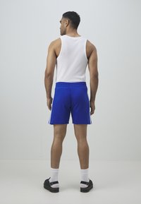 adidas Performance REAL MADRID DNA SHORT - Klub merchandise - collegiate royal