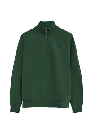 Jersey de manga larga verde oscuro con cuello alto y cremallera frontal, con un pequeño logo bordado en el pecho.