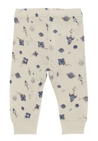 Crème-kleurige leggings met een ruimte-thema print van blauwe raketten, planeten en sterren. Zachte, elastische tailleband met opgerolde enkels.