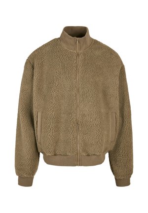 Fleecejakke i afdæmpet brun med lynlåslukning foran, høj krave og elastiske manchetter. Struktureret stof med to sidelommer.