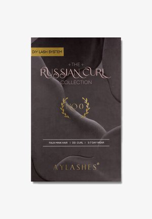Black packaging featuring the text "DIY Lash System" and "The Russian Curl Collection" in pink and gold. Faux mink hair lashes, labeled "No 0."