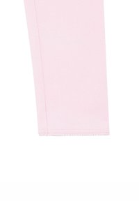 Leggings di cotone rosa chiaro con una consistenza liscia, caratterizzati da un design semplice e orlo cucito. Nessun motivo o decorazione visibile.