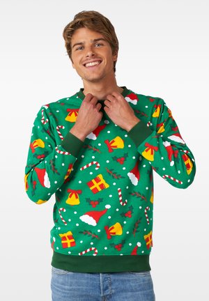 Grüner Sweatshirt mit festlichem Muster, das rote und gelbe Glocken, Weihnachtsmützen, Stechpalme, Zuckerstangen und Pünktchen umfasst. Gerippte Bündchen und Kragen.