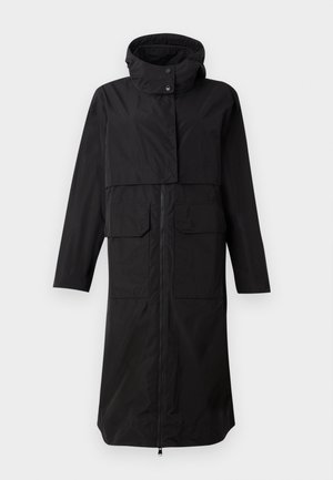 Black raincoat with a high collar, zip-up front, and two large front pockets. Made from a smooth, water-resistant material. Long fit.