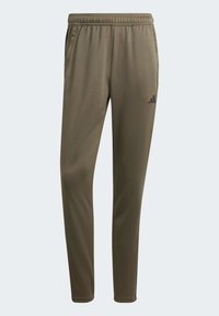 Olijfgroene sportbroeken met een getailleerde pasvorm, elastische tailleband en twee zijzakken. Bevat een zwart Adidas-logo op de linkerdij.