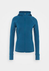 Teal lynlukkede hættejakke med en tætsiddende design, raglanærmer og sidelommer. Har tommelhuller i mansjetterne for ekstra komfort. Blød tekstur.