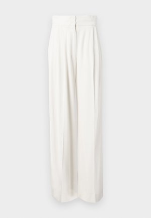 Hlače visokog struka, širokih nogavica od čvrste bijele tkanine. Imaju glatku teksturu s prednjim nabranim detaljima i skrivenim zatvaračem na stražnjoj strani.