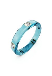 A translucent blue bangle features two hexagonal clear gems set in gold accents, showcasing a modern and elegant design.