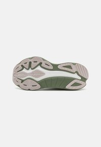 Saucony sneaker såle i grønn og hvit, med teksturert gummi og karakteristiske spor, samt et mønstret grep for godt feste.