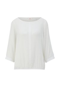 Blouse blanche à manches longues avec encolure ronde, tissu légèrement texturé et manches à revers, présentée sur un fond uni.