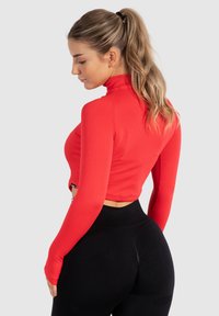 Smilodox SERINA - Træningsjakke - rot