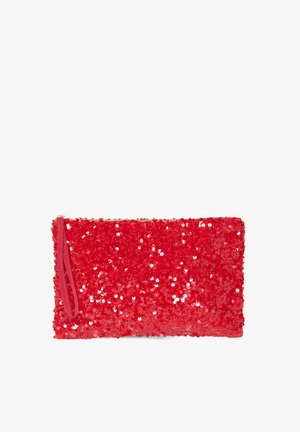 Punane sädelustasku, millel on lukuga sulgur ja randme rihm. Omab siledat tekstuuri ja ristkülikukujulist vormi, täielikult kaetud läikivate sädelustega.