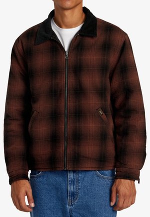 Bruin en zwart geblokt jack met een rits aan de voorkant, een corduroy kraag en zijzakken; gemaakt van textuurstof.