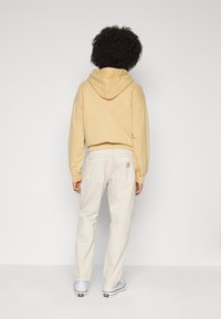 Carhartt WIP NEWEL PANT - Traperice opuštenog kroja - tonic stone dyed